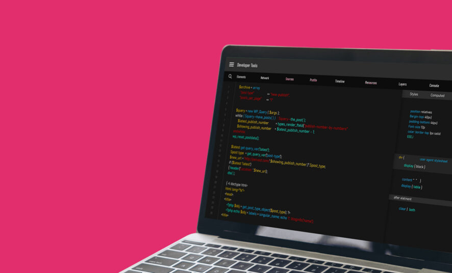 Coding tool open on a laptop against a hot pink background